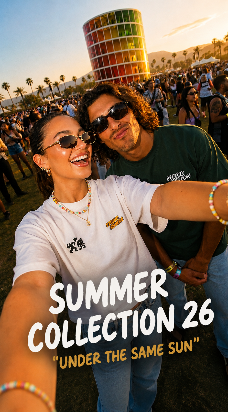 A couple taking a selfie at an outdoor festival during sunset, wearing sunglasses and matching white graphic t-shirts. Large text overlay reads 'SUMMER COLLECTION 26' and 'UNDER THE SAME SUN'.